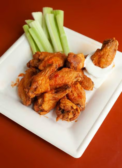 Buffalo wings with celery and bleu cheese